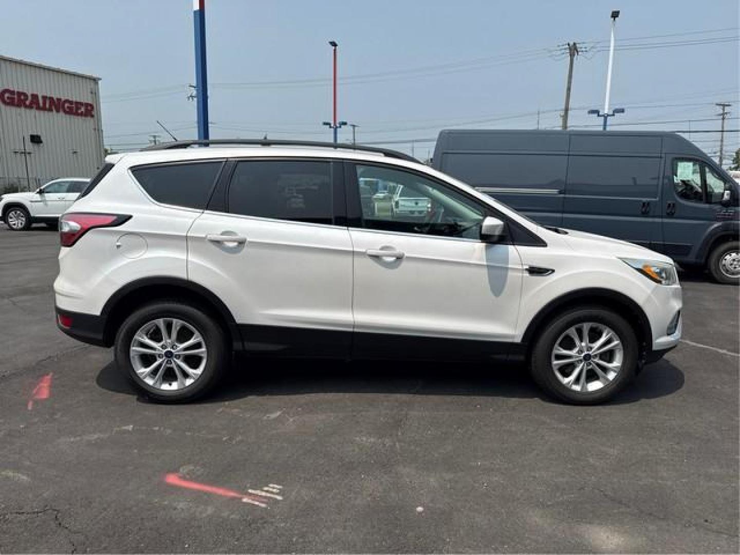 2017 WHITE FORD ESCAPE (1FMCU9GDXHU) with an L4,1.5L(91 CID),DOHC engine, AUTOMATIC transmission, located at 14600 Frazho Road, Warren, MI, 48089, (586) 776-3400, 42.485996, -82.974220 - Photo#4