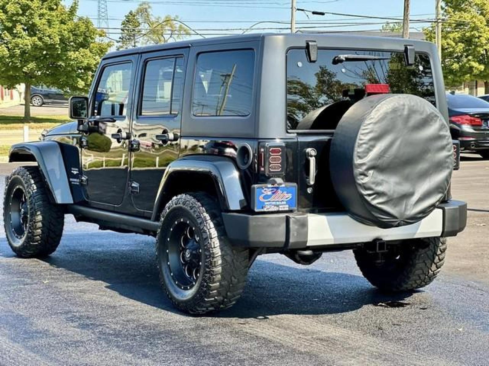 2013 BLACK JEEP WRANGLER SAHARA (1C4BJWEG6DL) with an V6,3.6L(220 CID),DOHC engine, AUTOMATIC transmission, located at 14600 Frazho Road, Warren, MI, 48089, (586) 776-3400, 42.485996, -82.974220 - Photo #6