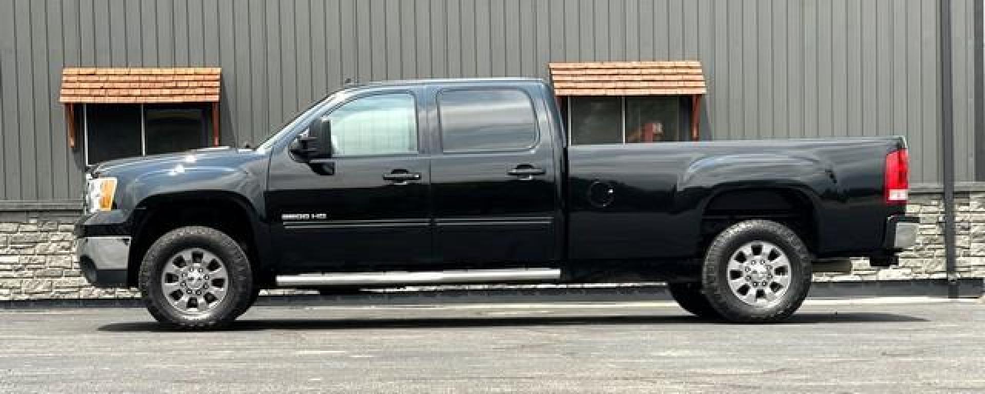 2012 BLACK GMC SIERRA 3500 HD (1GT424C85CF) with an V8,6.6L(403 CID),OHV engine, AUTOMATIC transmission, located at 14600 Frazho Road, Warren, MI, 48089, (586) 776-3400, 42.485996, -82.974220 - Photo#1