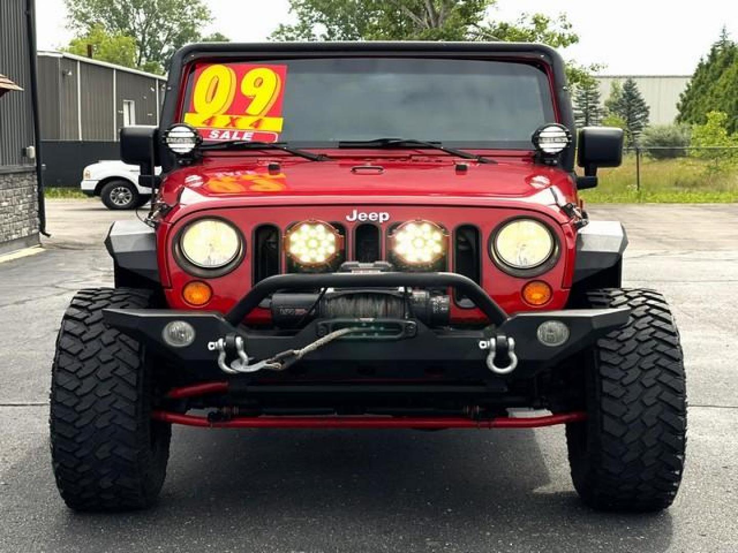 2009 RED JEEP WRANGLER (1J4GA39179L) with an V6,3.8L(231 CID),OHV engine, MANUAL transmission, located at 14600 Frazho Road, Warren, MI, 48089, (586) 776-3400, 42.485996, -82.974220 - Photo#2