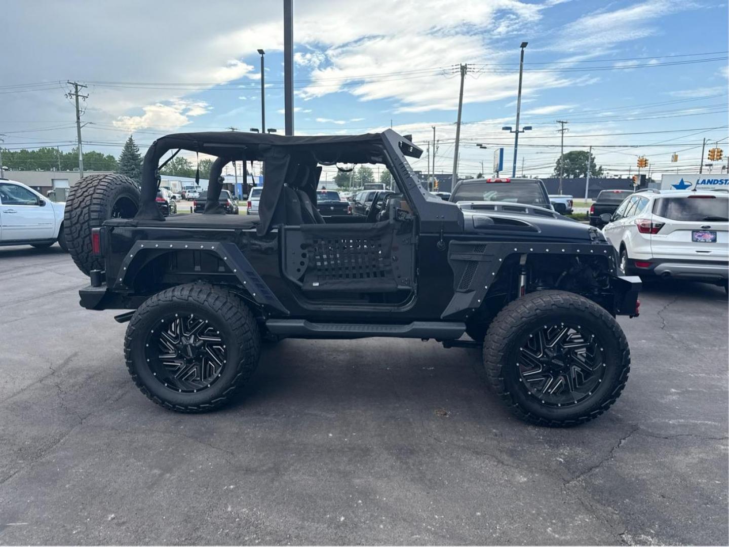 2016 BLACK JEEP WRANGLER (1C4AJWBG1GL) with an V6,3.6L(220 CID),DOHC engine, AUTOMATIC transmission, located at 14600 Frazho Road, Warren, MI, 48089, (586) 776-3400, 42.485996, -82.974220 - Photo#3