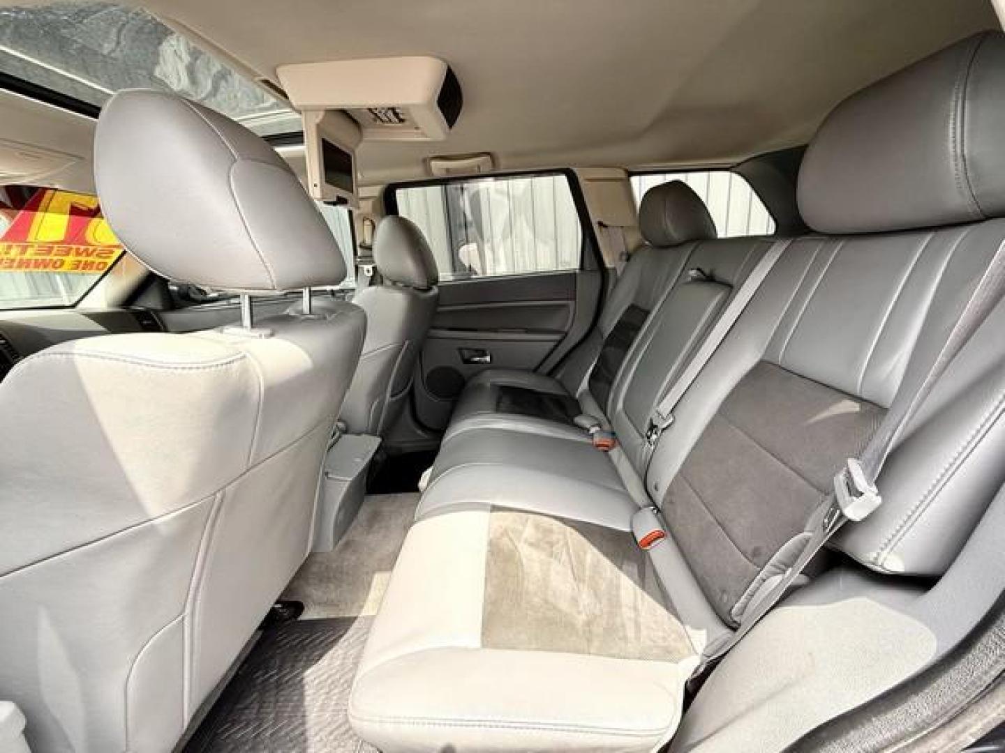 2007 BLACK JEEP GRAND CHEROKEE (1J8HR78357C) with an V8,6.1L(370 CID),OHV engine, AUTOMATIC transmission, located at 14600 Frazho Road, Warren, MI, 48089, (586) 776-3400, 42.485996, -82.974220 - Photo#11