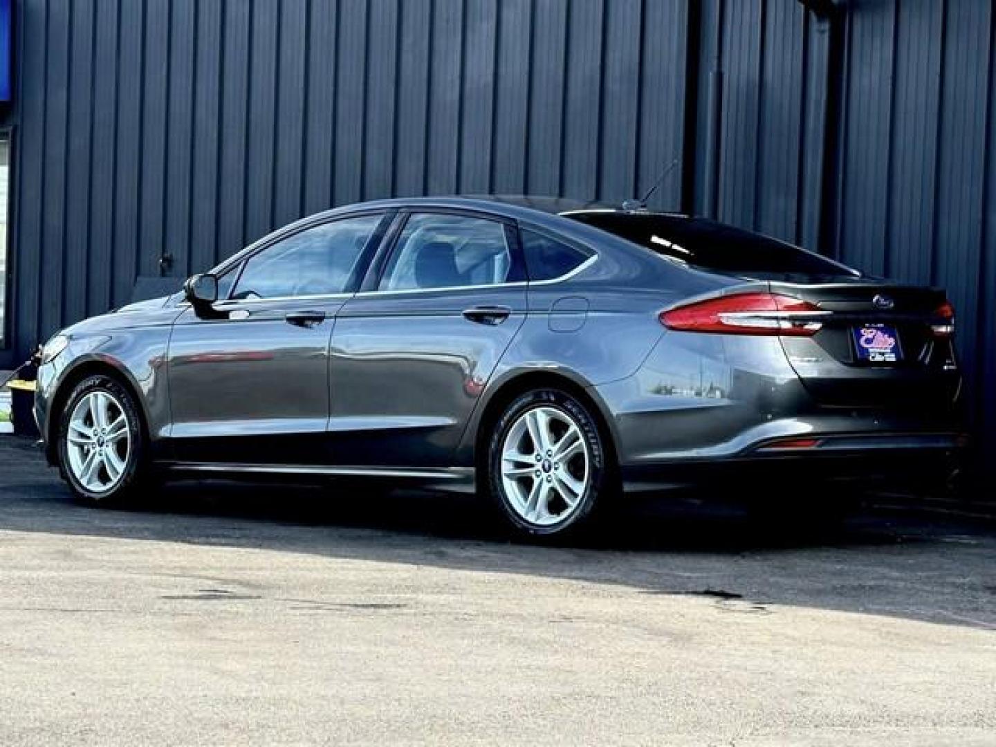 2018 GRAY FORD FUSION (3FA6P0HDXJR) with an L4,1.5L(91 CID),DOHC engine, AUTOMATIC transmission, located at 14600 Frazho Road, Warren, MI, 48089, (586) 776-3400, 42.485996, -82.974220 - Photo#7