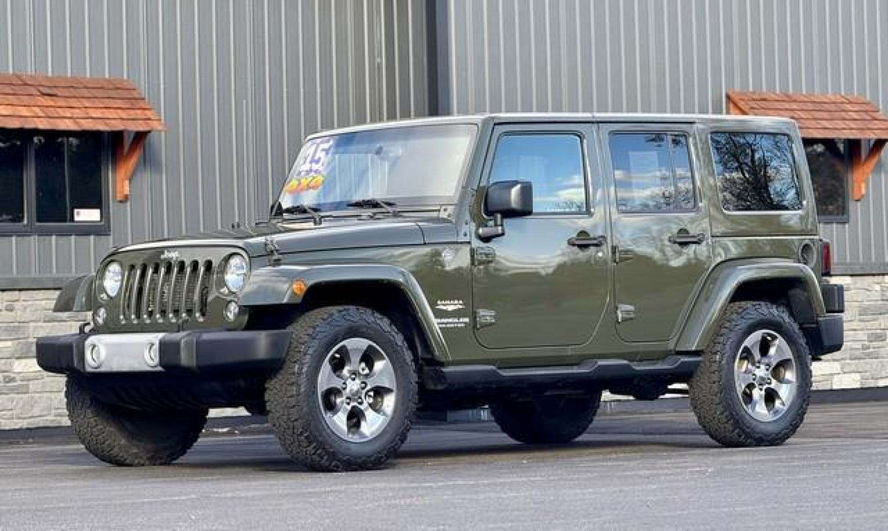 2015 GREEN JEEP WRANGLER (1C4BJWEG7FL) with an V6,3.6L(220 CID),DOHC engine, AUTOMATIC transmission, located at 14600 Frazho Road, Warren, MI, 48089, (586) 776-3400, 42.485996, -82.974220 - Photo#1