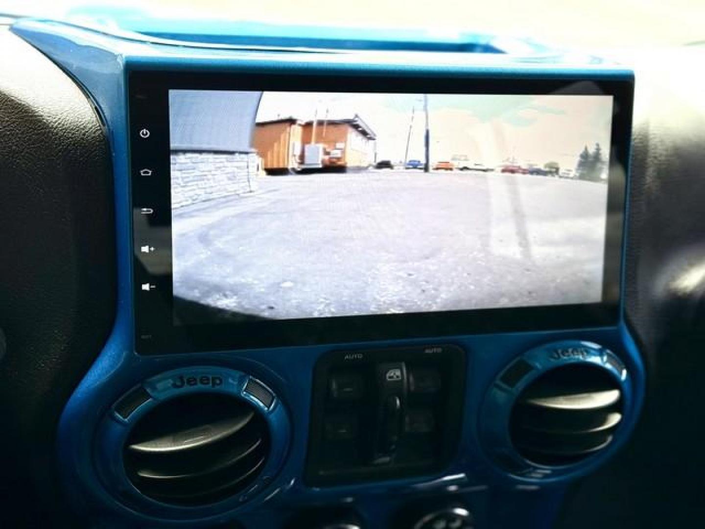 2015 HYDRO BLUE JEEP WRANGLER (1C4BJWEG0FL) with an V6,3.6L(220 CID),DOHC engine, AUTOMATIC transmission, located at 14600 Frazho Road, Warren, MI, 48089, (586) 776-3400, 42.485996, -82.974220 - Photo#16